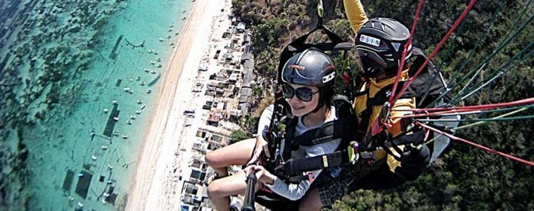 Paragliding above the beautiful Bali coastline.