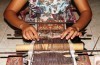 Ni Luh Suryati weaving a double ikat