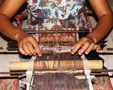 Ni Luh Suryati weaving a double ikat