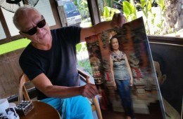 Lonny Gerungan shows a picture of his mother at his new restaurant.