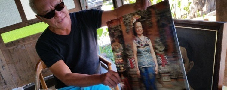 Lonny Gerungan shows a picture of his mother at his new restaurant.